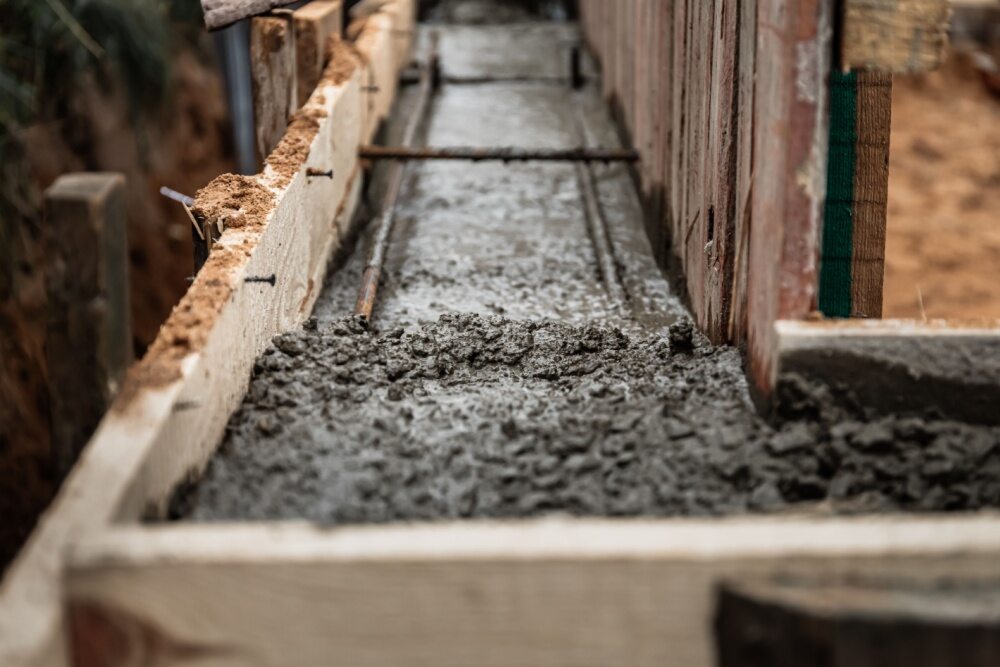Formwork with concrete running through 