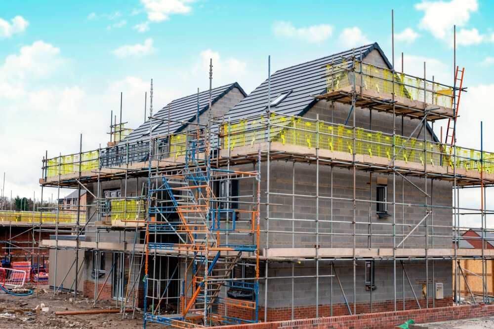 Erected scaffolding around new construction.